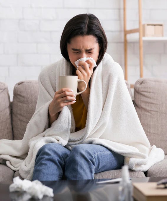 woman sick covid shutterstock 1700809078