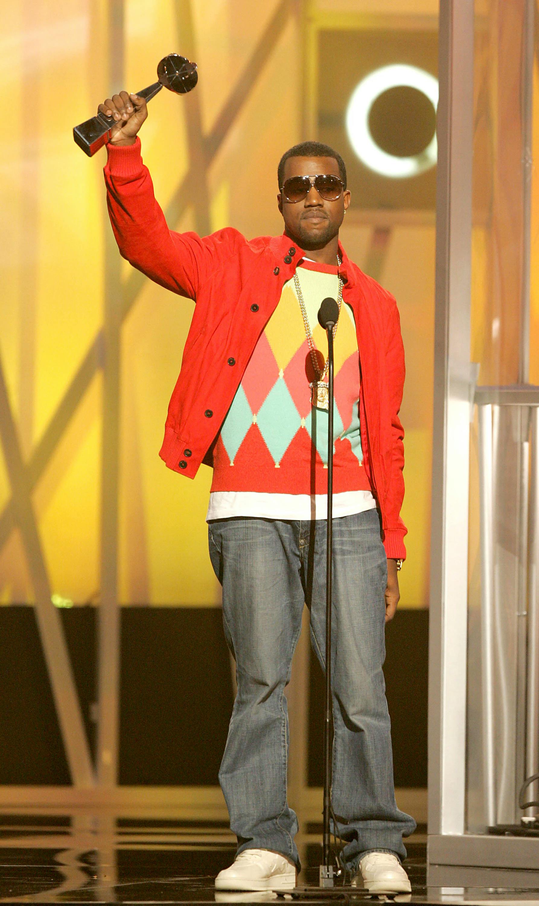 Rapper/producer Kanye West accepts the award for Male New Artist of the Year during the 2004 Billboard Music Awards. (Photo by Kevin Winter/GettyImages)